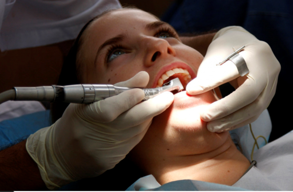 A young lady has dental work done at a local dentist in Jerusalem July 22, 2008. (credit: DANIEL DREIFUSS/FLASH 90)
